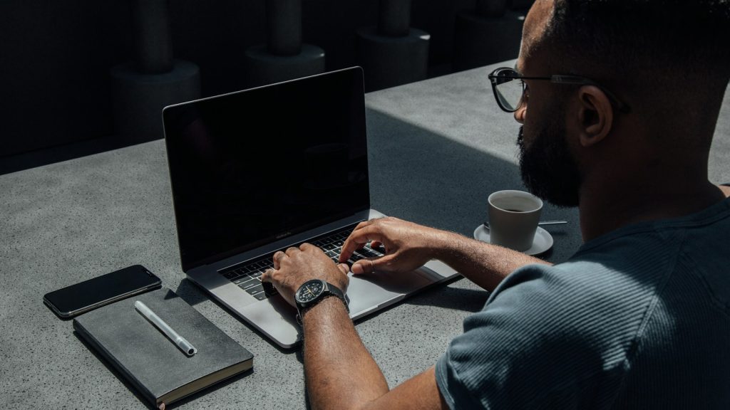 Person using a laptop to check whether WordPress contact form emails are arriving